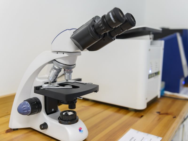 A microscope and other machines in lab on a table